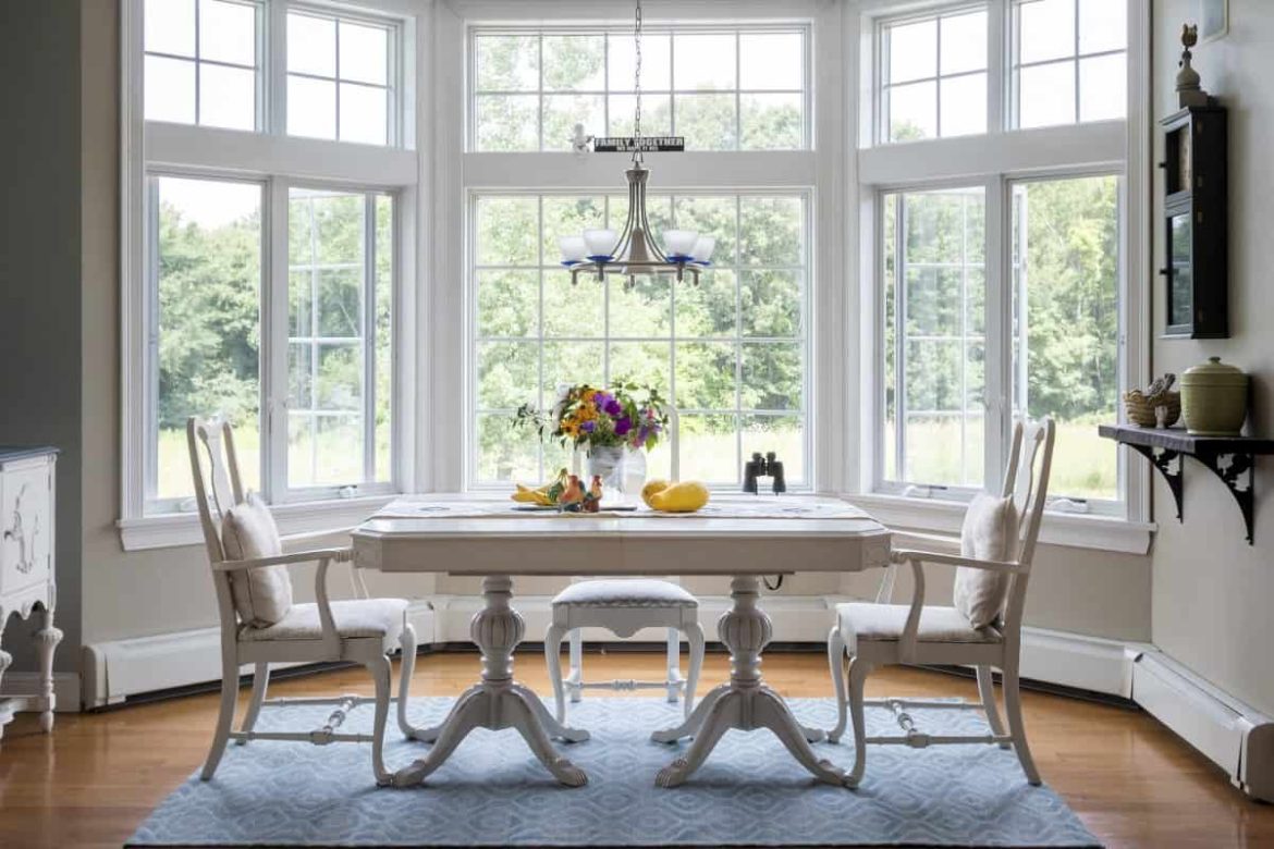 Dining table in living room which is room’s focal point